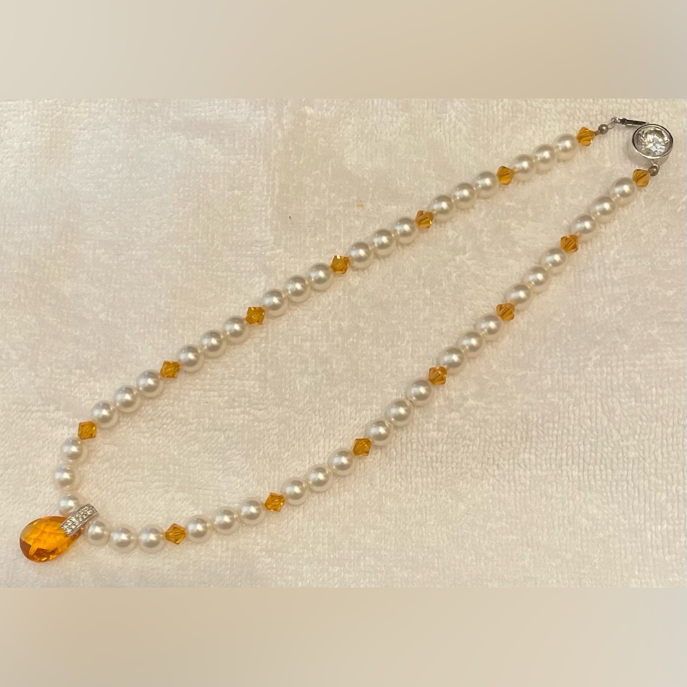 Necklace w/ pearl like and amber colored beads, beautiful clasp